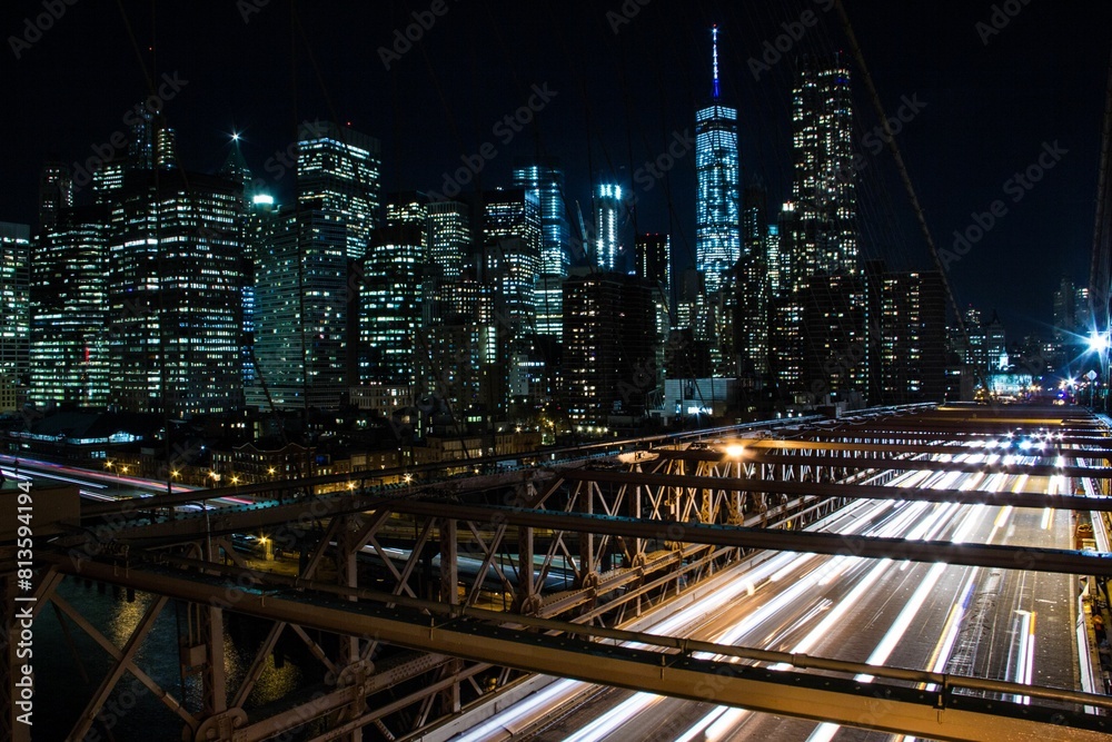 Fototapeta premium Night view from cable-stayed Brooklyn bridge cityscape background, New York