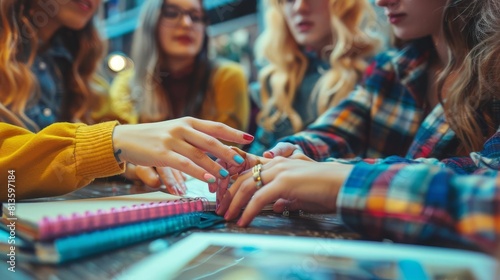 Closeup of a college students chipped nail polish hands debating hangover cures before a final exam photo