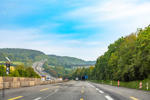 driving along the Highway A7 direction Kirchheimer crossing in hilly landscape with constructiion site