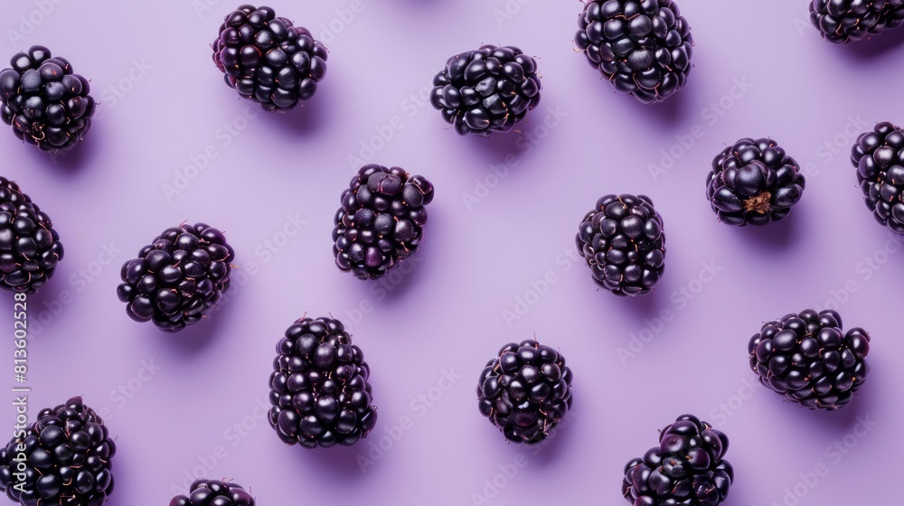 A blackberry surrounded by some blackberry clusters A blackberry surrounded by some blackberry clusters