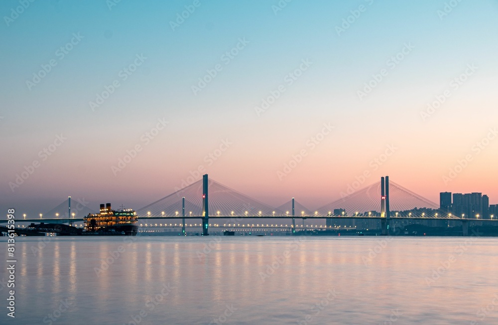 Bridges and cruise ships on the Yangtze River in the early morning, Wuhan, China. Bridges and cruise ships on the Yangtze River in the early morning, Wuhan, China.