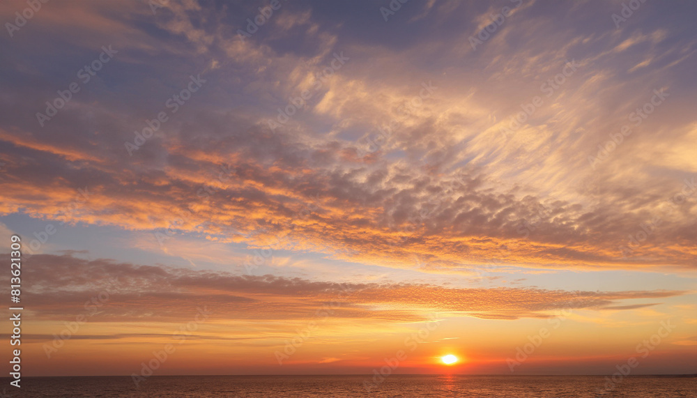 Naklejka premium Real majestic sunrise sundown sky background with gentle colorful clouds.
