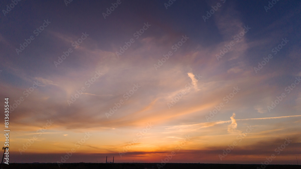 A picturesque orange sunrise or sunset on the horizon. Drone photo A picturesque orange sunrise or sunset on the horizon. Drone photo