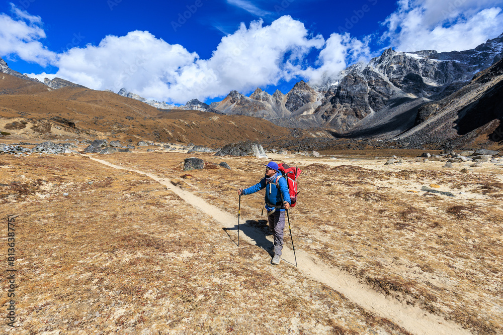 Sherpa mountain guide after passing the Renjo La (pass, 5,417m) near the village Lunden on the Great Himalaya Trail (GHT) and the Three passes Trek in the Everest region, Himalaya, Nepal