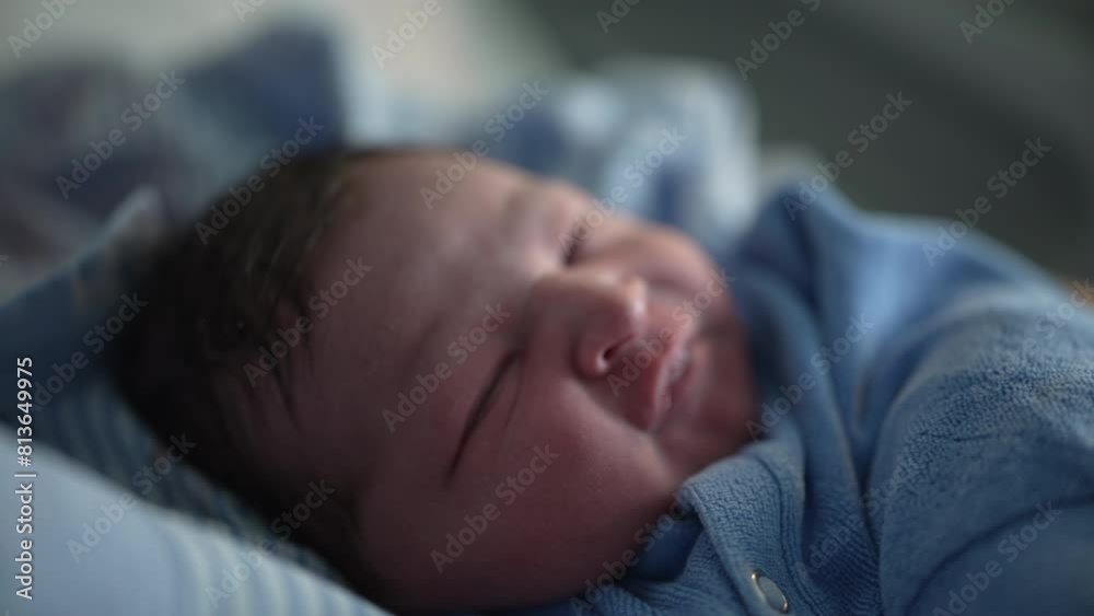 Newborn baby infant close-up face in the first days of life awake during initial week Newborn baby infant close-up face in the first days of life awake during initial week