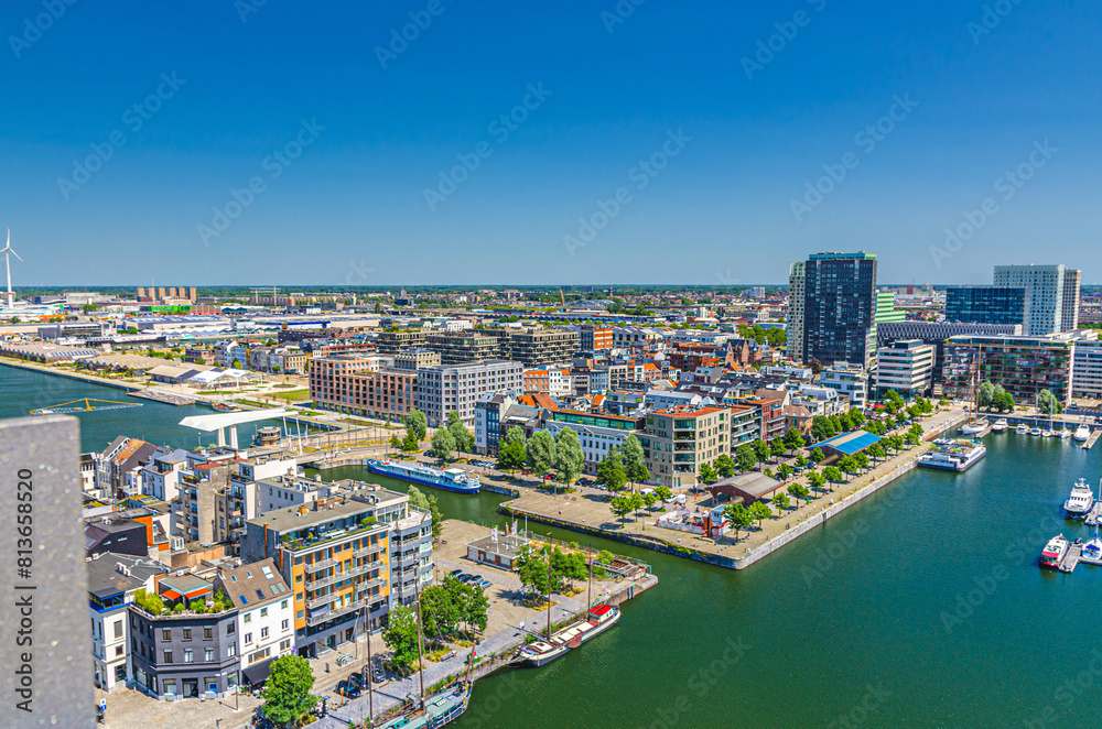 Obraz premium Antwerp cityscape, aerial panoramic view of Antwerp city Eilandje quarter neighborhood with port area, water canals, Bonaparte Dock, skyline horizon panorama of Antwerpen, Flemish Region, Belgium