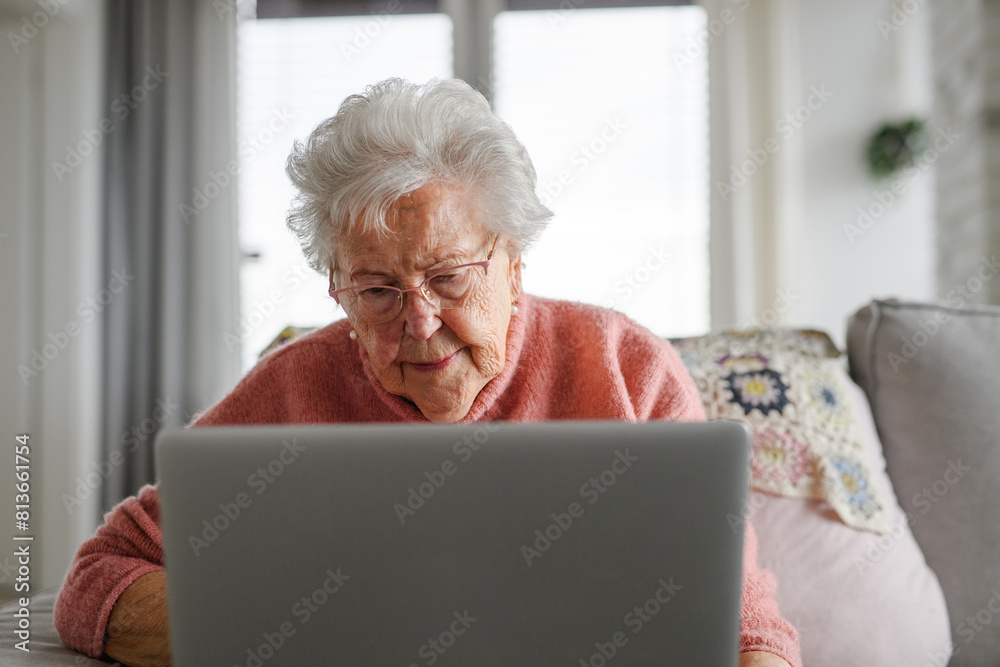 Senior woman learning to work with tablet, technology and internet. Importance of digital literacy for elderly people. Senior woman learning to work with tablet, technology and internet. Importance of digital literacy for elderly people.