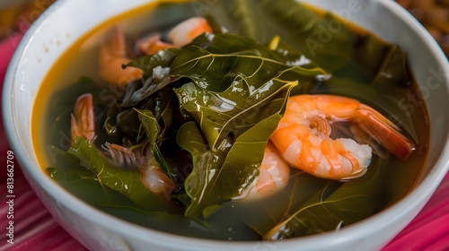 Tacaca, a spicy soup made with jambu leaves and shrimp photo