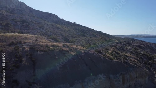 Cliffs on Imgiebah Bay Beach Mellieha, Selmun peninsula, Aerial view of Imgiebah Bay. High quality 4k footage photo