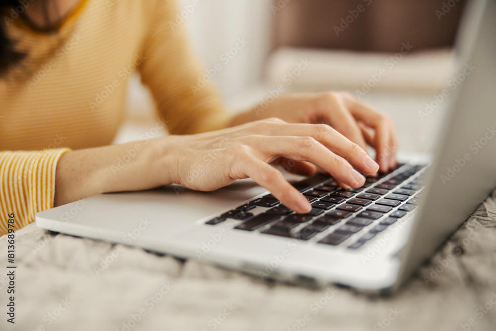 Close up of hands typing on a laptop. Close up of hands typing on a laptop.