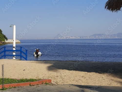 Jet Ski ancorado em praia calma - Jet Ski anchored on a calm beach photo