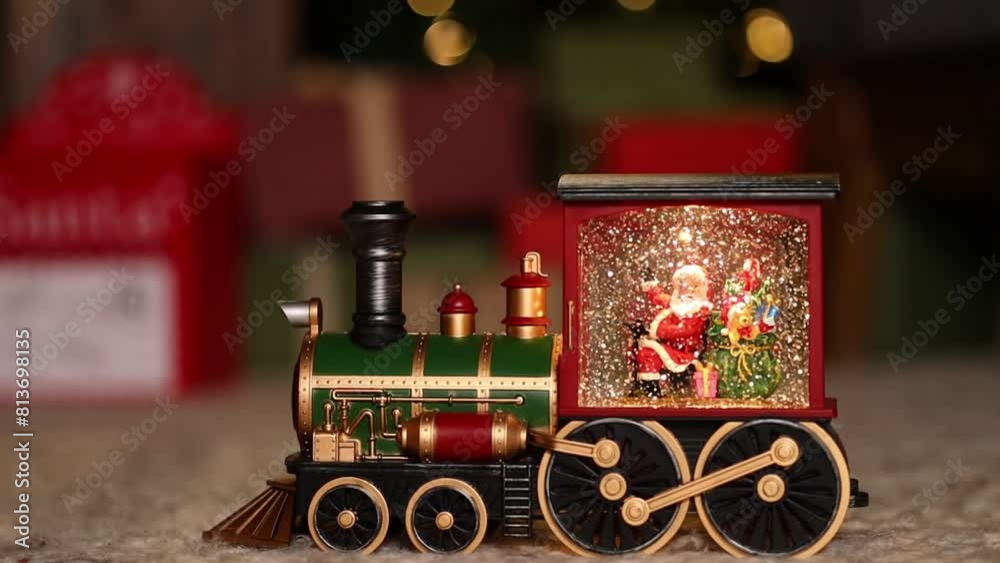 New Year's toy train with Santa Claus. Christmas and New Year