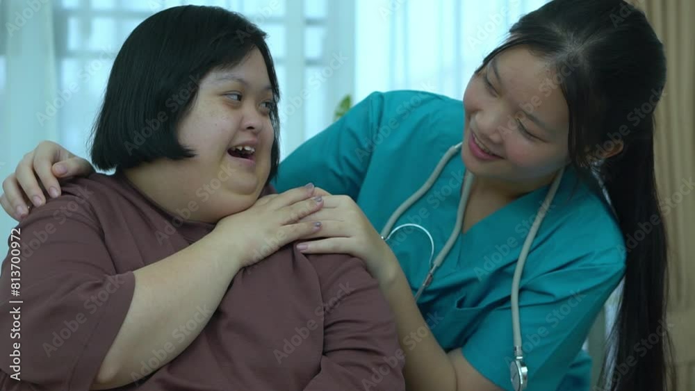 Asian female doctor Supporting patients with Dow Syndrome at home.