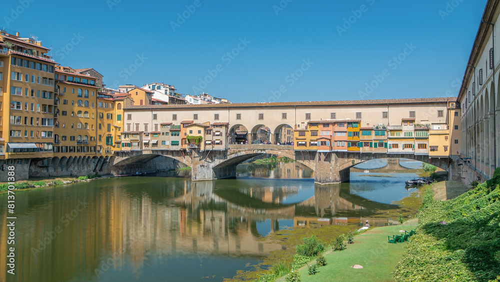 The Ponte Vecchio on a sunny day timelapse, a medieval stone segmental arch bridge over the Arno River in Florence, Italy The Ponte Vecchio on a sunny day timelapse, a medieval stone segmental arch bridge over the Arno River in Florence, Italy