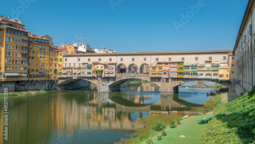 The Ponte Vecchio on a sunny day timelapse, a medieval stone segmental arch bridge over the Arno River in Florence, Italy