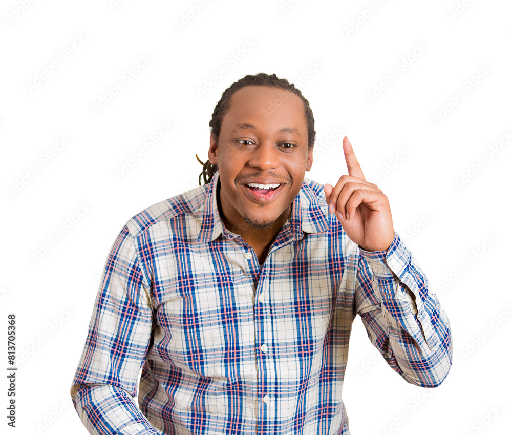 Portrait of young smiling man pointing his finger in eureka sign, having great innovative idea, understanding or solution Portrait of young smiling man pointing his finger in eureka sign, having great innovative idea, understanding or solution