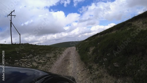 View from the car on the Bermamit plateau, Caucasus. The Grand Canyon in Russia. Mountain landscape on a summer day. The blue sky of Karachay-Cherkessia. The Caucasian Ridge. 4K photo