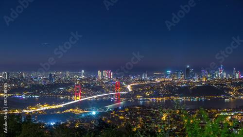 Istanbul city skyline cityscape night time lapse view of bosphorus bridge and financial business center