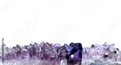 eautiful druses of natural purple mineral amethyst on a white background. Healing chakra crystals. Copy space. photo