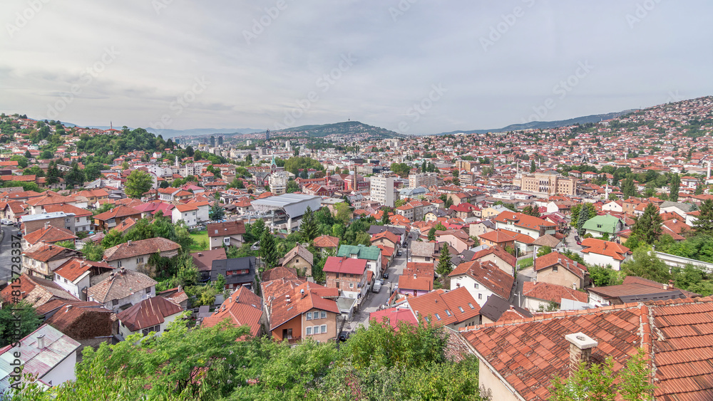 Obraz premium City panorama with cable car moving up and down from Sarajevo station to mountains, Bosnia And Herzegovina
