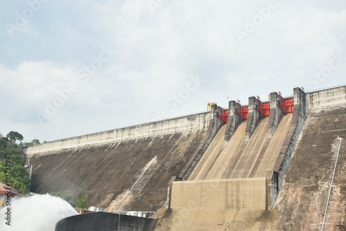 water splashing from floodgate Khun Dan Prakarn Chon huge concrete dam in Thailand photo