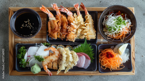 a tempura platter displayed on a wooden serving tray, with an assortment of crispy battered seafood and vegetables, accompanied by tentsuyu dipping sauce and grated daikon. photo