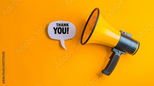 megaphone with speech bubble "THANK YOU" on yellow background