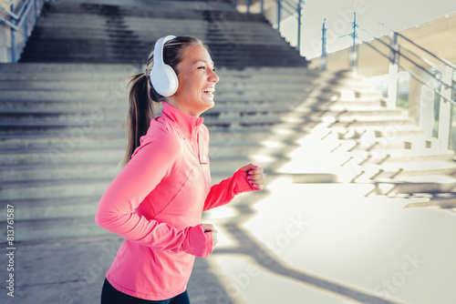 Canvas Print Exercise workout of young woman running for health and fitness across city