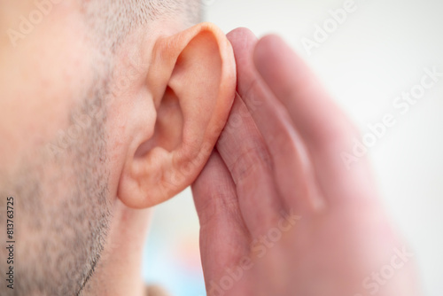 Close-up detail young male ear, poor hearing, Ear Discomfort, Hearing Test, ringing or buzzing sensation, Auditory impairment, Medical condition