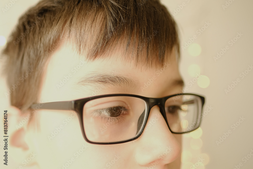 close up part male child's face, eyes of boy 10-12 years old in glasses, concept vision examination, eyestrain, diagnosis, treatment of ophthalmic diseases, eyelids, emotional development of children close up part male child's face, eyes of boy 10-12 years old in glasses, concept vision examination, eyestrain, diagnosis, treatment of ophthalmic diseases, eyelids, emotional development of children