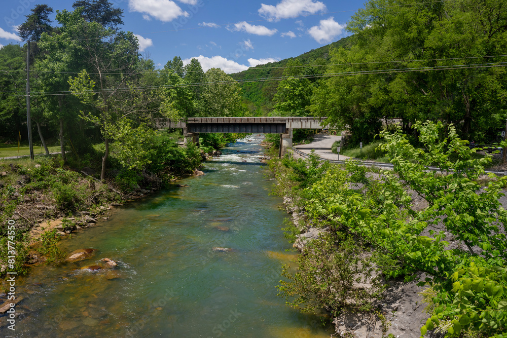 Fototapeta premium A view of Big Soddy Creek Gulf from the bridge on Back Valley Road. A family-friendly trail runs along the river and offers beautiful cliffside and river views.