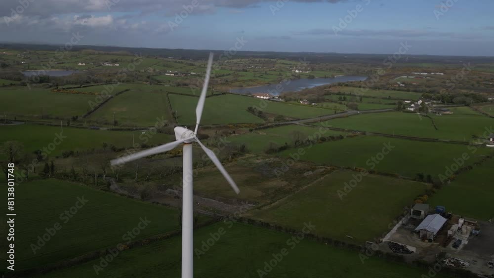 Drone shot flying around a single wind turbine in a rural environment in Northern Ireland. Drone shot flying around a single wind turbine in a rural environment in Northern Ireland.