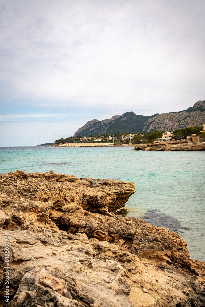 Rocky beach in the Victoria town in Mallorca Spain on a cloudy summer day