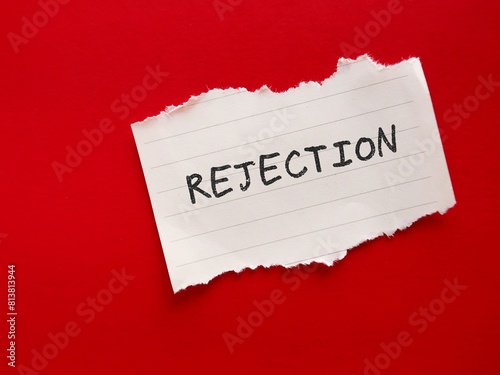 Tableau sur toile Toen paper note on red background with text written REJECTION, concept of being