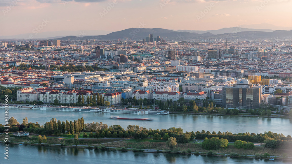 Aerial panoramic view of Vienna city with skyscrapers, historic buildings and a riverside promenade timelapse in Austria. Aerial panoramic view of Vienna city with skyscrapers, historic buildings and a riverside promenade timelapse in Austria.