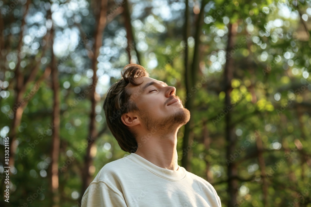 Mindfulness and meditation. Man in White Sweatshirt Finding Peace Amidst Nature