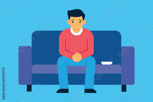 a frustrated man sitting on the couch at night.