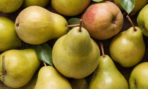 Various apples and pears tightly packed together, with both green and red apples and green pears visible, all having their stems intact.