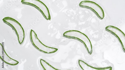 Fresh aloe vera slices is slowly rotating. Organic cosmetics, alternative medicine. Top view.
