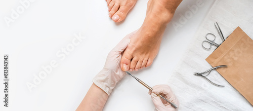 Pedicure, podologist. Patient on medical pedicure procedure, nail disease, cholesis detachment of the nail plate. Foot care, treatment in a medical spa salon.