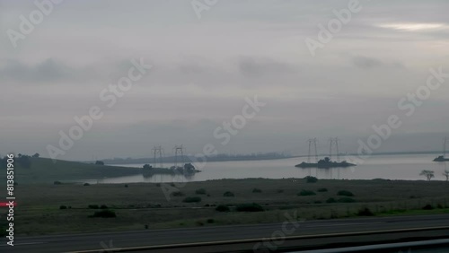 Footage of O'Neill Forebay Reservoir from a car while driving by at sunset in California, USA photo