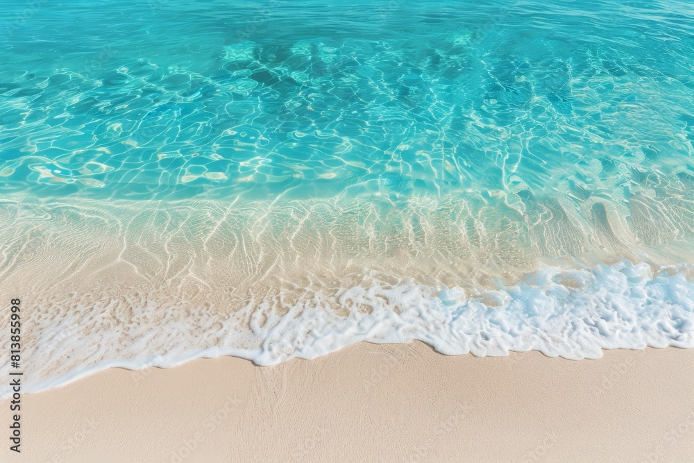 Closeup of crystalclear turquoise water lapping against a white sandy beach The empty background creates space to emphasize the idyllic shoreline of a remote island Closeup of crystalclear turquoise water lapping against a white sandy beach The empty background creates space to emphasize the idyllic shoreline of a remote island