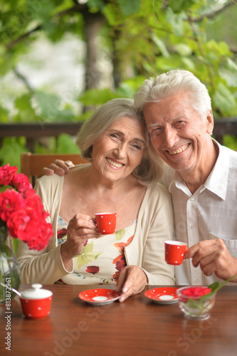 Close up portrait of happy couple drinking coffee