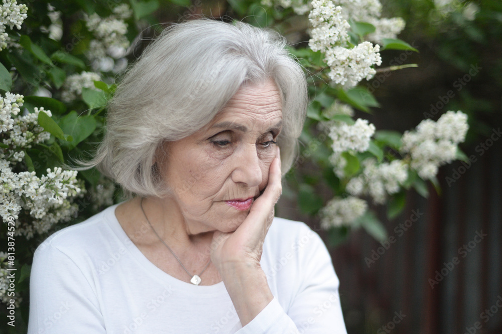 Portrait of senior sad woman in park Portrait of senior sad woman in park