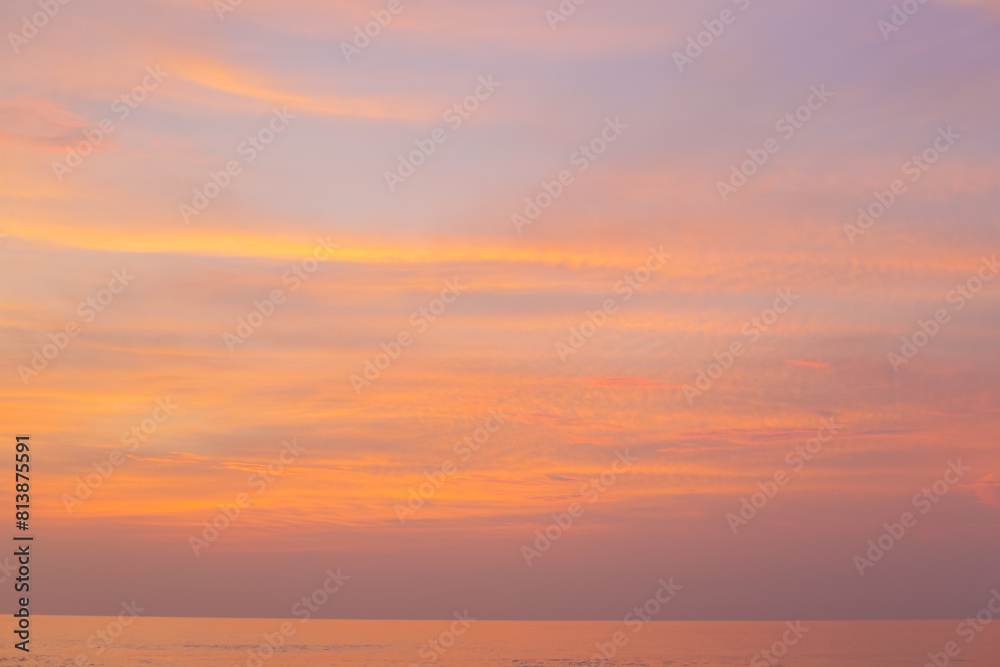 Beautiful peach sunset over the ocean. View of the sky at sunset.