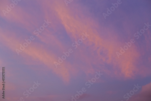 Peach clouds against a lilac sky