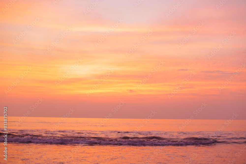 A beautiful golden sunset over the ocean. Peach Nature Background