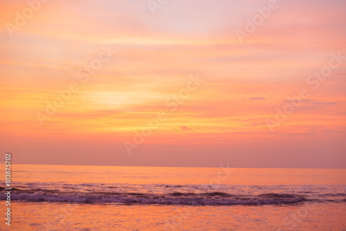 A beautiful golden sunset over the ocean. Peach Nature Background