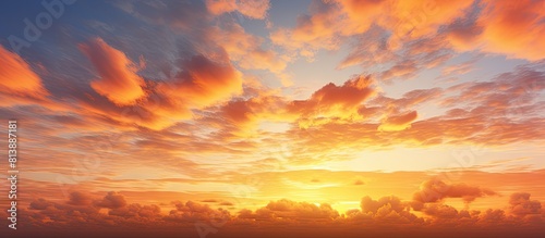 The sky at sunset displays a stunning fiery orange hue creating a captivating and vibrant image with ample copy space
