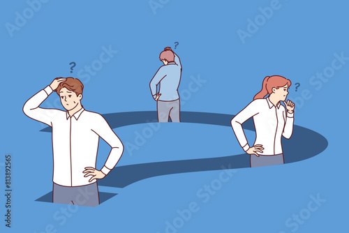 Confused business people are standing inside big question trying to find way out of deadlock. Question prevents team of office employees from moving forward to achieve goals and objectives